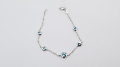 BLUE TOPAZ BEZEL SET 14 KT WHITE GOLD BRACELET