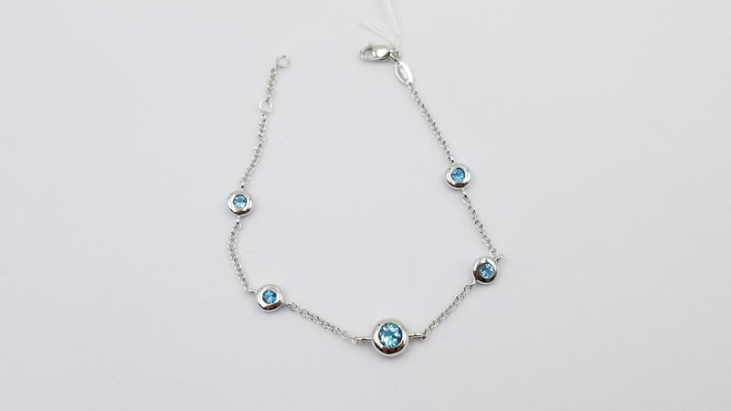 BLUE TOPAZ BEZEL SET 14 KT WHITE GOLD BRACELET