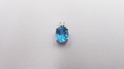 BLUE TOPAZ  (OVAL )8X10 MM  14 KT WHITE GOLD PENDANT