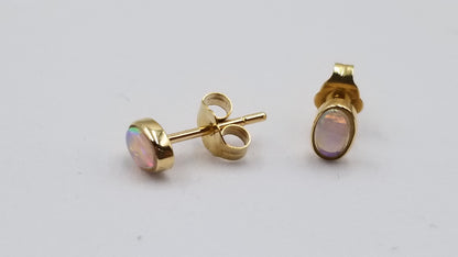 OPAL ( AUSTRALIAN ) OVAL BEZEL SET 14 KT YELLOW GOLD STUD EARRINGS