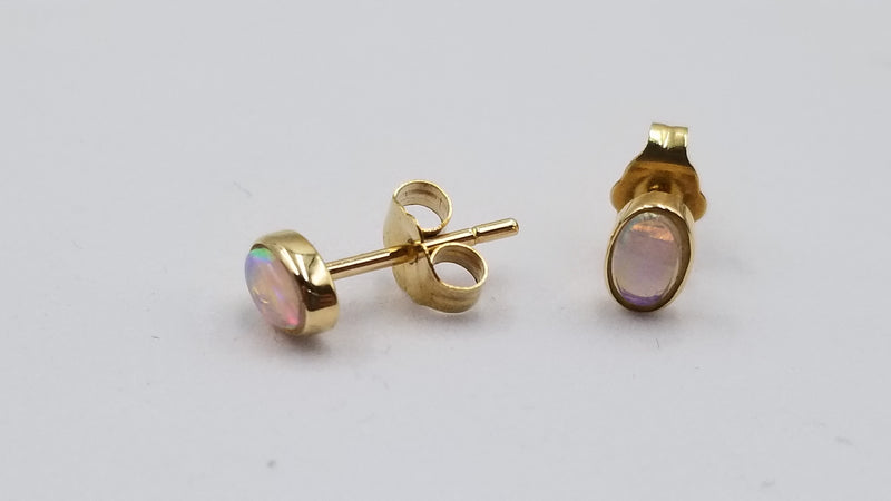 OPAL ( AUSTRALIAN ) OVAL BEZEL SET 14 KT YELLOW GOLD STUD EARRINGS