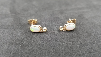 OPAL ( AUSTRALIAN ) OVAL BEZEL SETWITH DIAMOND 14 KT YELLOW GOLD STUD EARRINGS