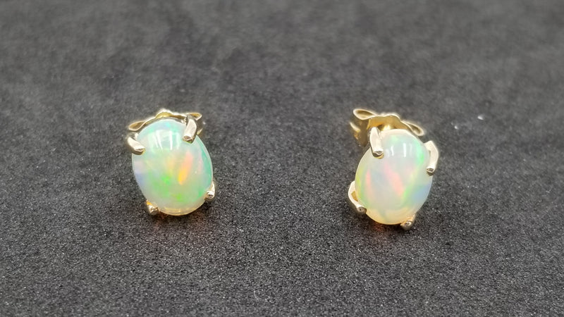 OPAL ( ETHOEPIAN )6X8 MM OVAL SHAPE 14 KT YELLOW GOLD STUD EARRINGS