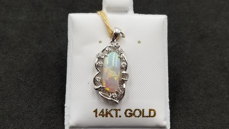 OPAL ( AUSTRALIA ) FREEFORM CUT WITH DIAMONDS 18 KT WHITE GOLD PENDANT