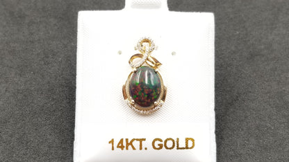 BLACK OPAL ( ETHEOPIAN ) OVAL 8X10 MM WITH DIAMONDS 14 KT YELLOW GOLD PENDANT