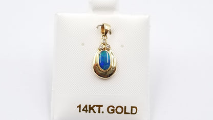 BOULDER OPAL DOUBLET BEZEL SET WITH DIAMONDS 14 KT YELLOW GOLD PENDANT