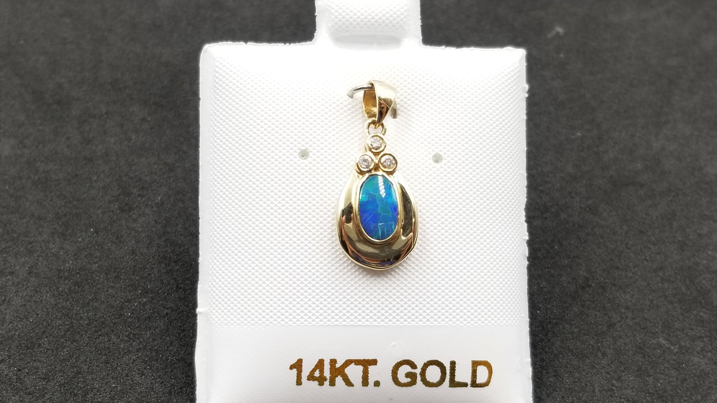 BOULDER OPAL DOUBLET BEZEL SET WITH DIAMONDS 14 KT YELLOW GOLD PENDANT