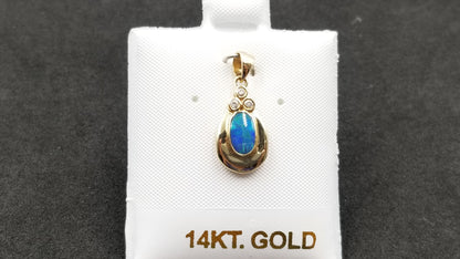 BOULDER OPAL DOUBLET BEZEL SET WITH DIAMONDS 14 KT YELLOW GOLD PENDANT